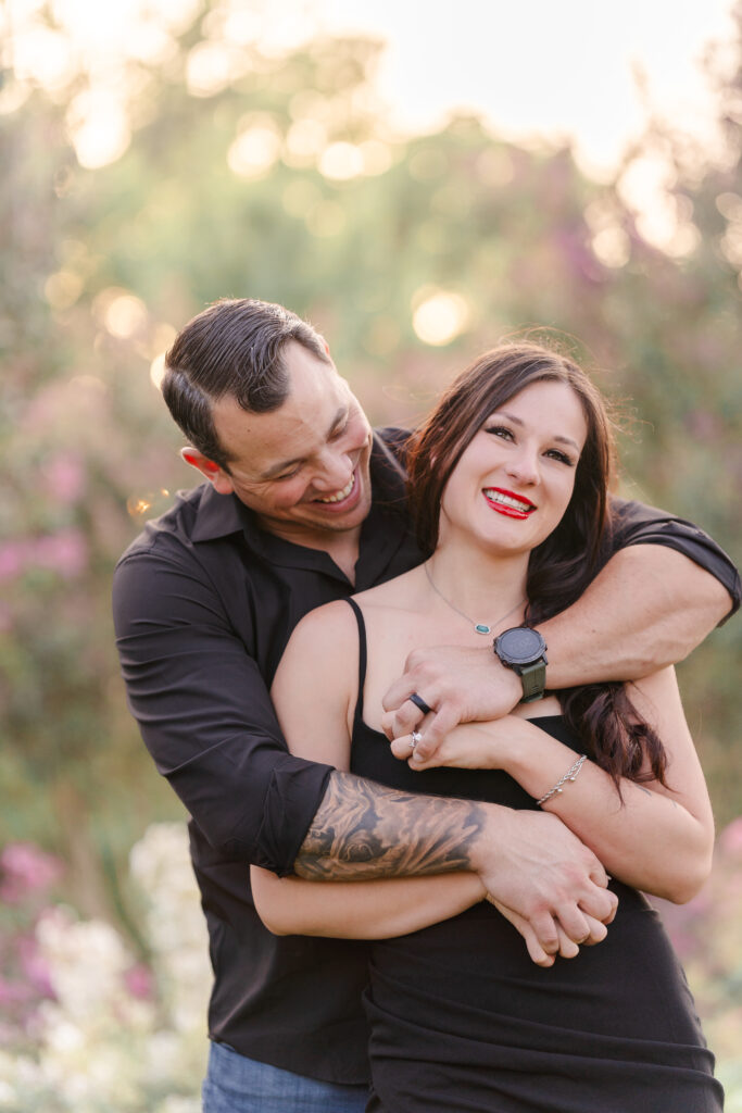 Married couple embracing during a golden hour weekend family photo session in Mckinney