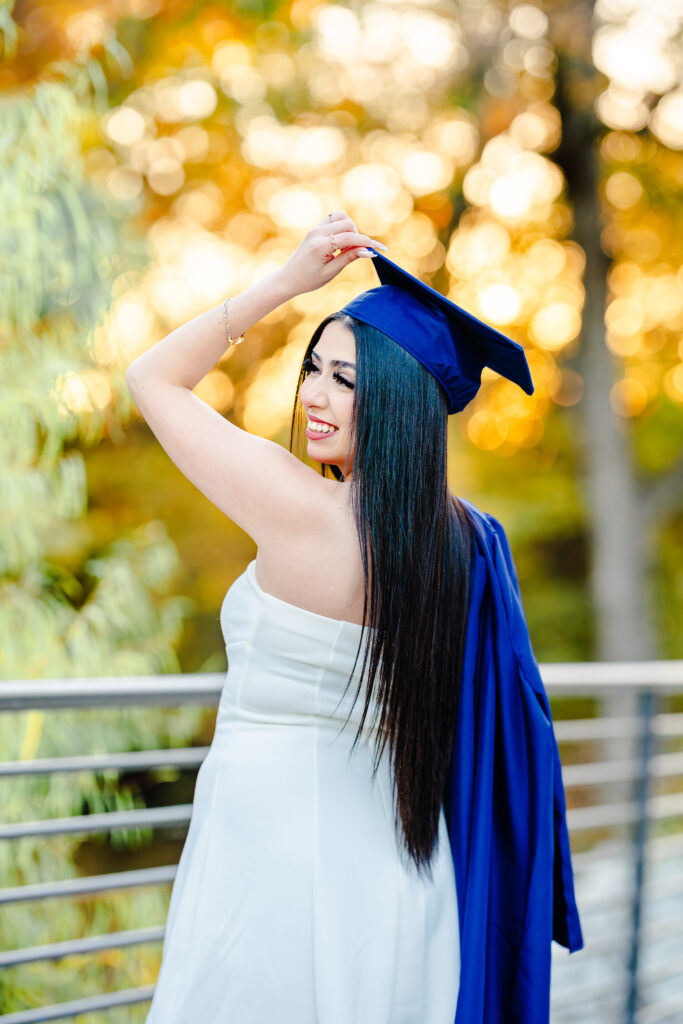 High School Senior cap n gown photo at a North Texas fall location