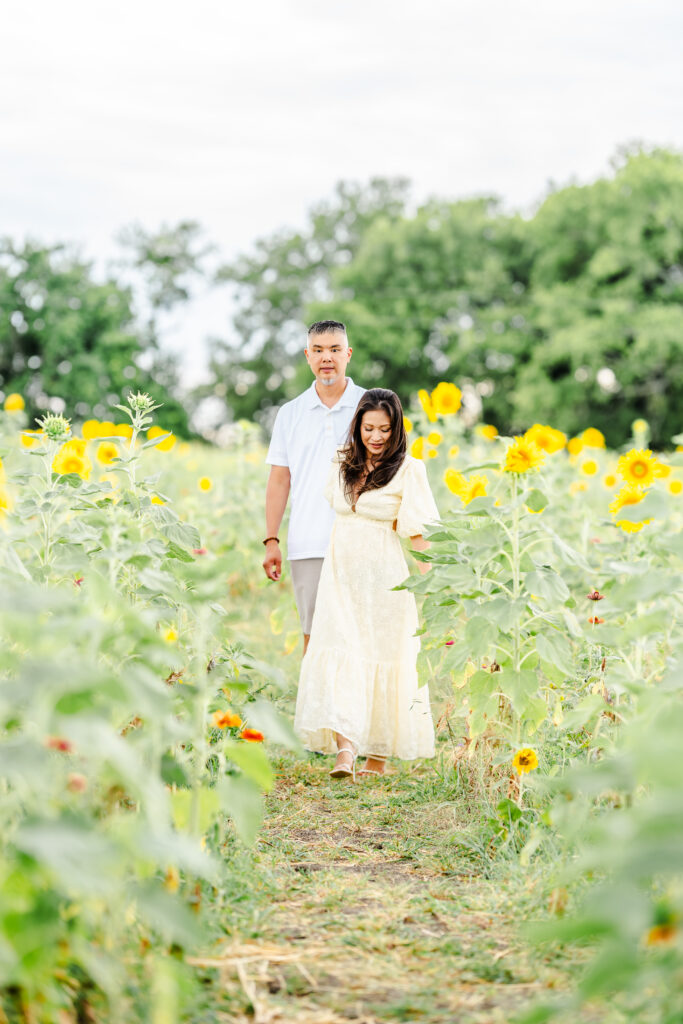 Joyful summer family portraits in sunflower field at The Little Sunflower Farm near Dallas