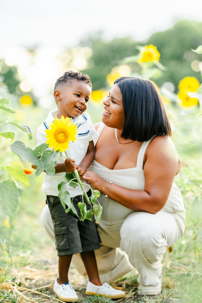 Joyful summer family portraits in sunflower field at The Little Sunflower Farm near Dallas