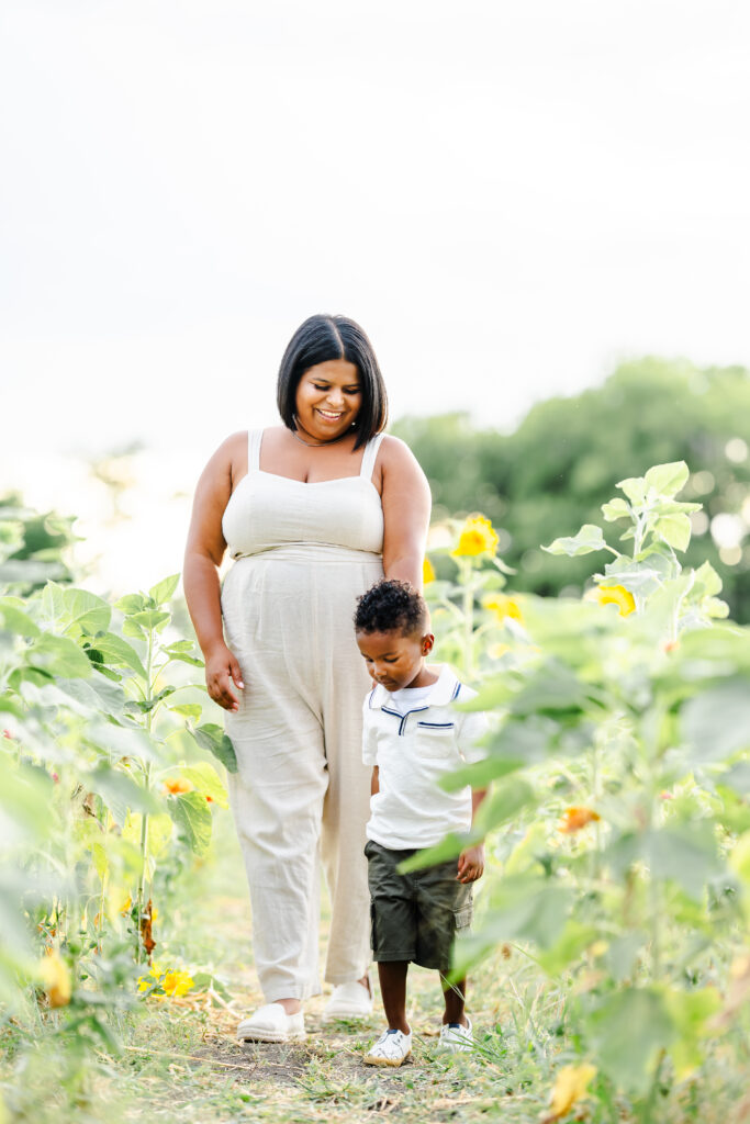 Joyful summer family portraits in sunflower field at The Little Sunflower Farm near Dallas