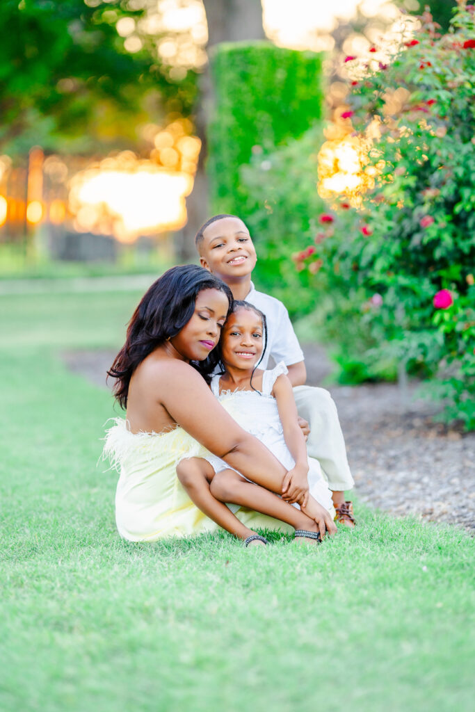 Mother embracing her son and daughter during a golden hour session in Frisco, Texas captured by Frisco family photographer Tonaya Noel Photography.