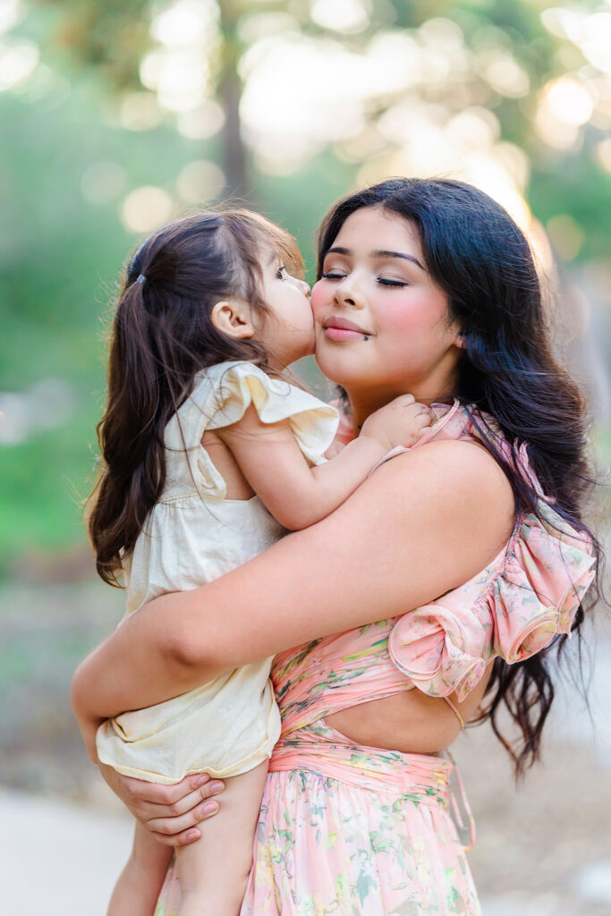 Mother and daughter sharing a quiet outdoor moment during a family day in Dallas